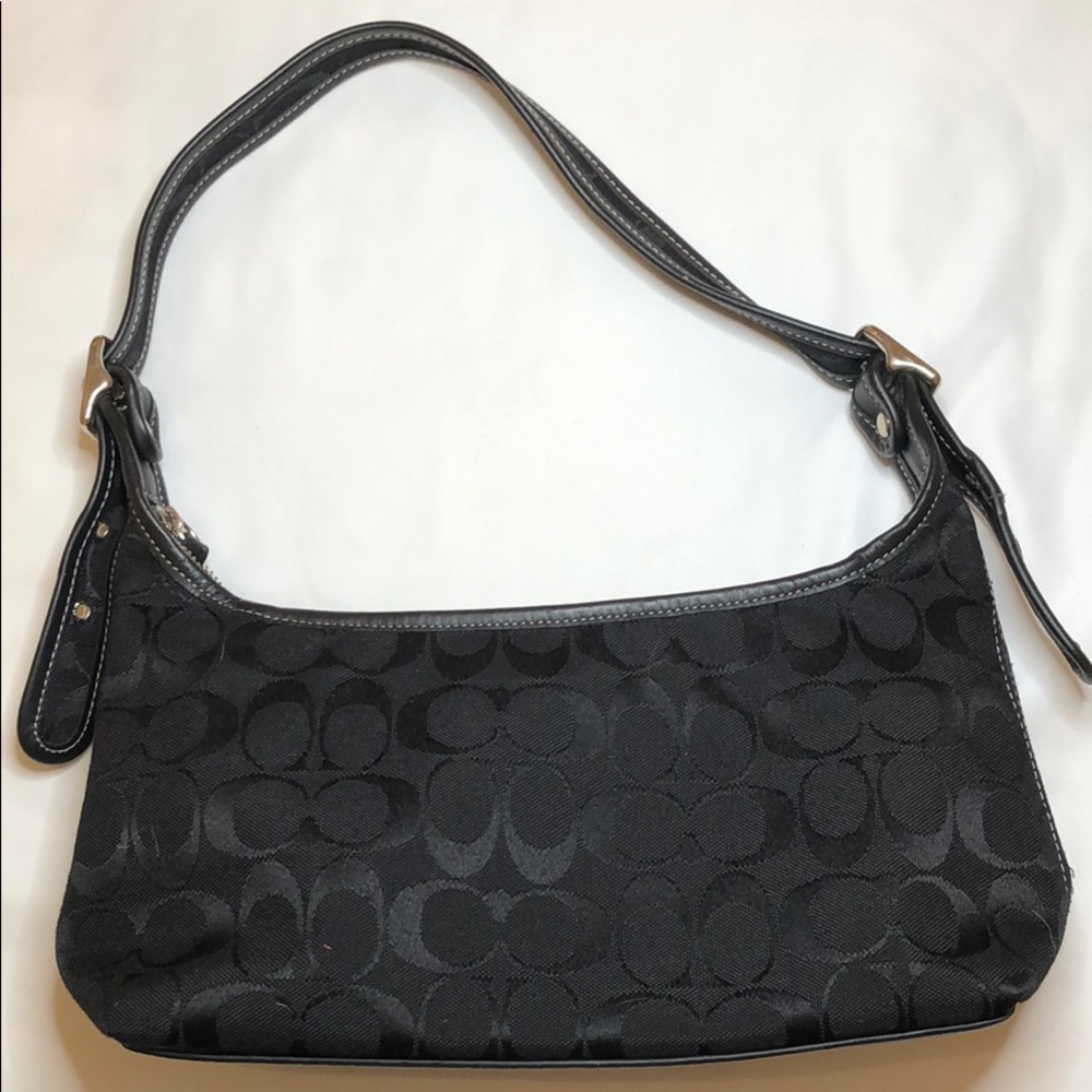 Coach purse with signature black on black fabric.